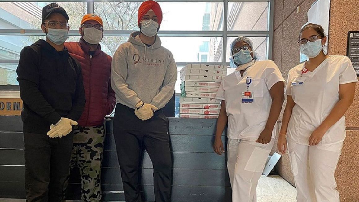 Sikh community members deliver pizza for frontline workers in New York