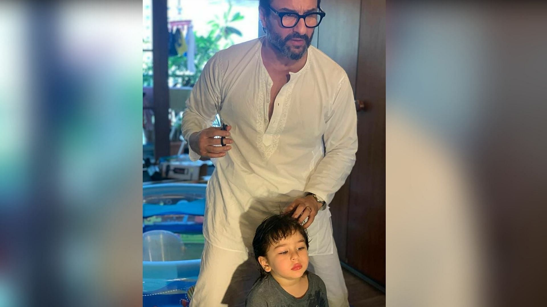 Saif Ali Khan giving Taimur a haircut.