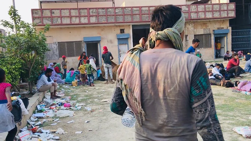 As soon as you enter the hall, where migrants who are left behind were being asked to stay with their belongings, there is dirt as far as your eyes can see.