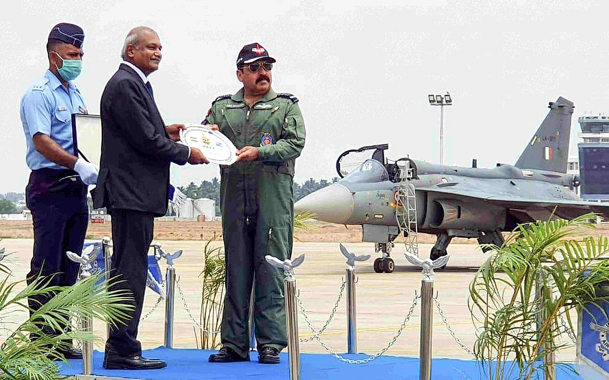 IAF chief RKS Bhadauria receives the first FOC standard LCA from HAL chairperson R Madhavan during a function held at Air Force Station in Sulur of Coimbatore district. 