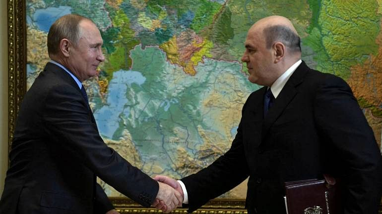 File photo of Vladimir Putin and Mikhail Mishustin (right).