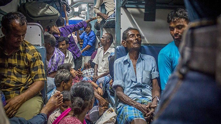 Exhausted migrant labourers who shuttle weekly between Anantapur in Andhra Pradesh and Kochi in Kerala - image used for representational purposes