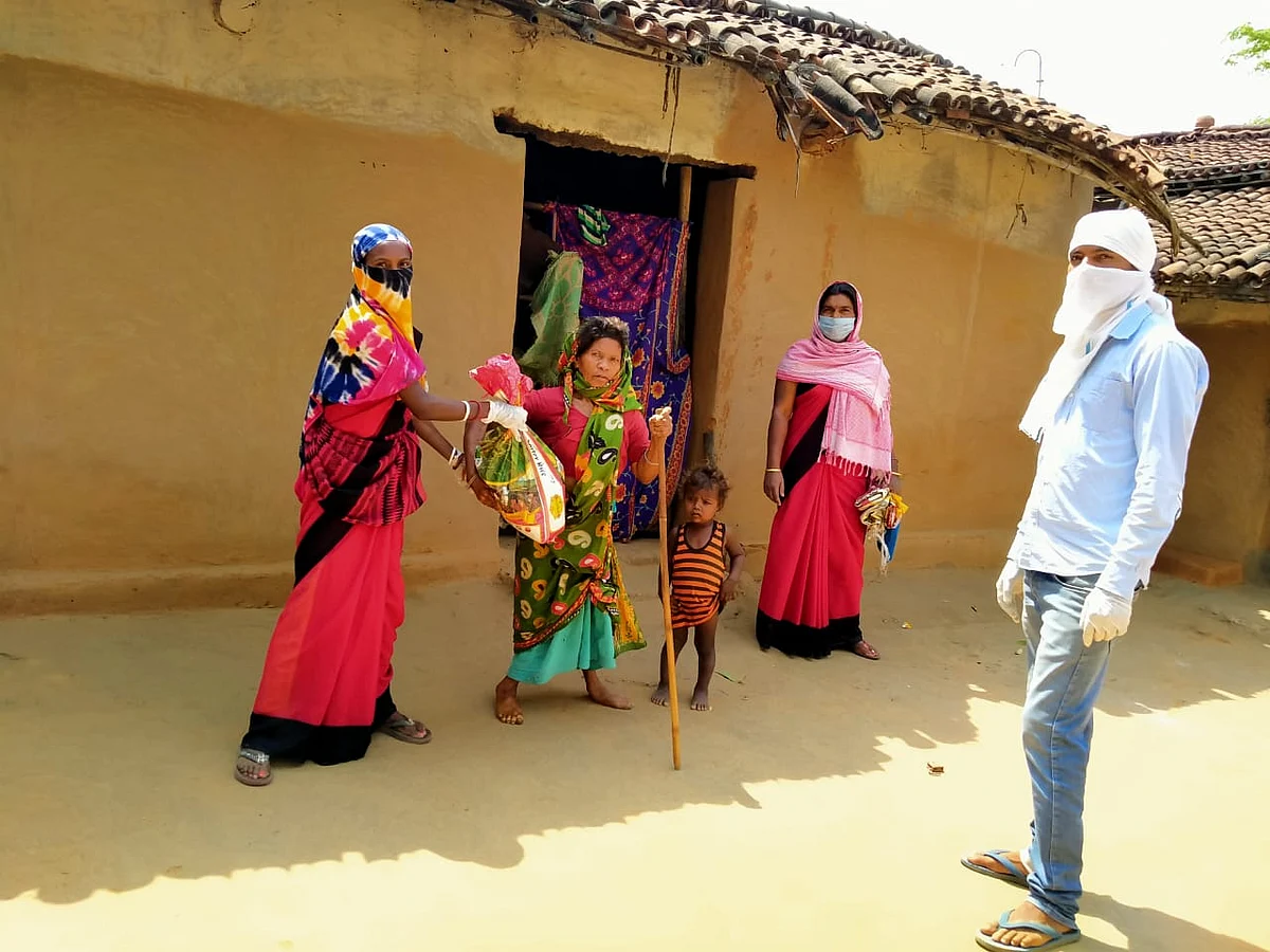 Rupye Devi receiving ration.