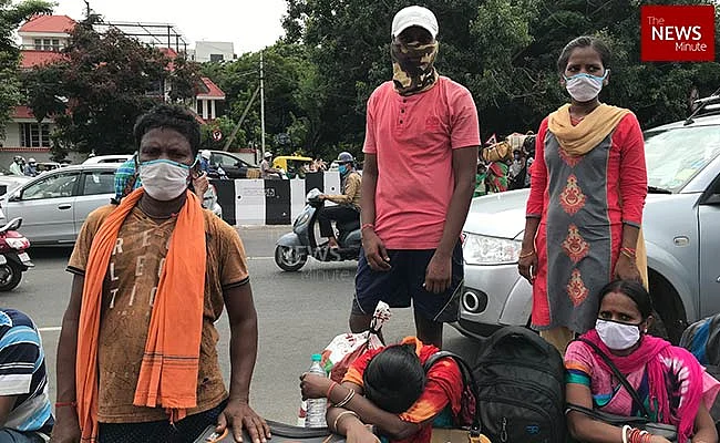 Charan and his family outside gate 3 at Palace Grounds