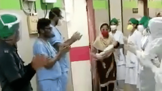 Hospital staff claps for baby who recovered from COVID-19