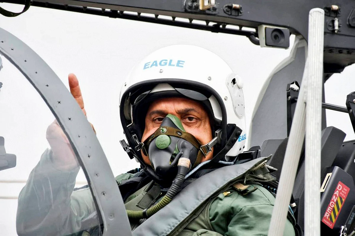 IAF chief RKS Bhadauria prepares to fly Tejas single-seater Light Combat Aircraft (LCA), during its induction ceremony on 27 May. 