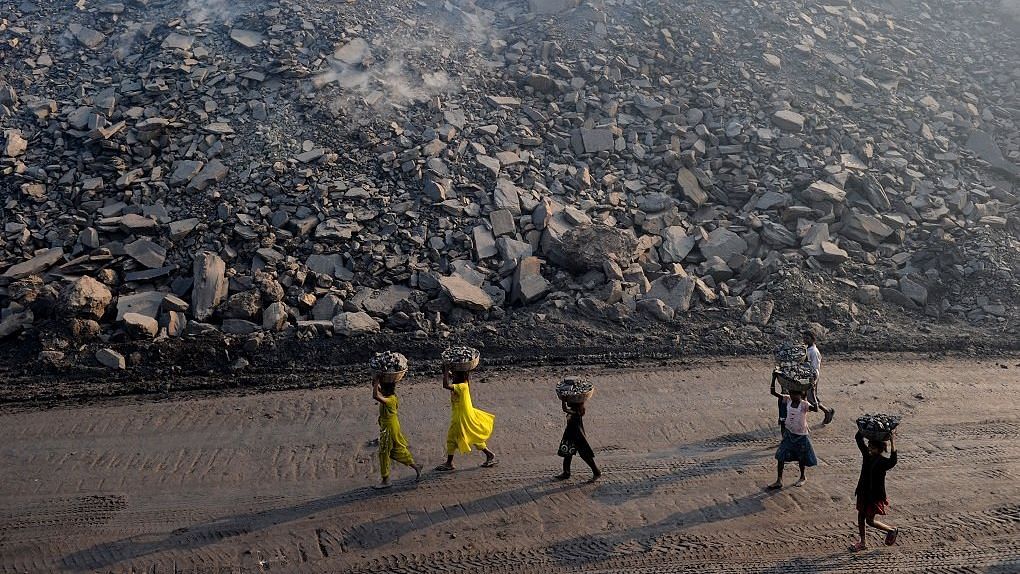 Jharia children collect coal from coalfields in Jharkhand.