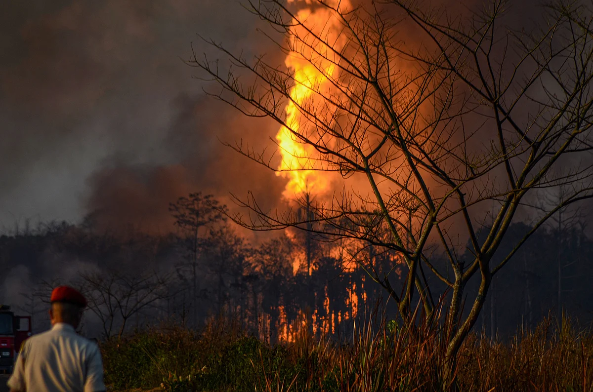 Smoke billows from a fire at Baghjan oil field, a week after a blowout, in Tinsukia district.