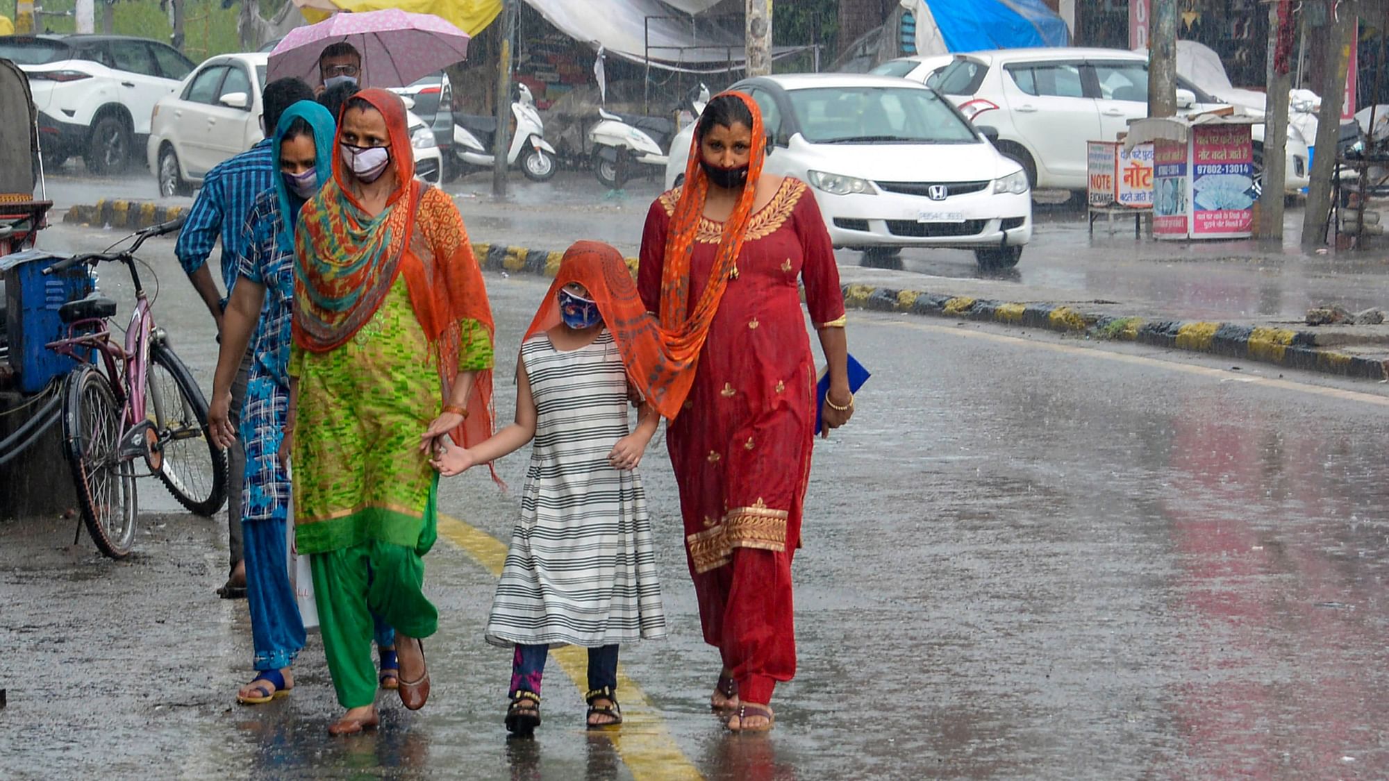 People walk through rain in Jalandhar on Wednesday, 24 June. Image used for representation only.