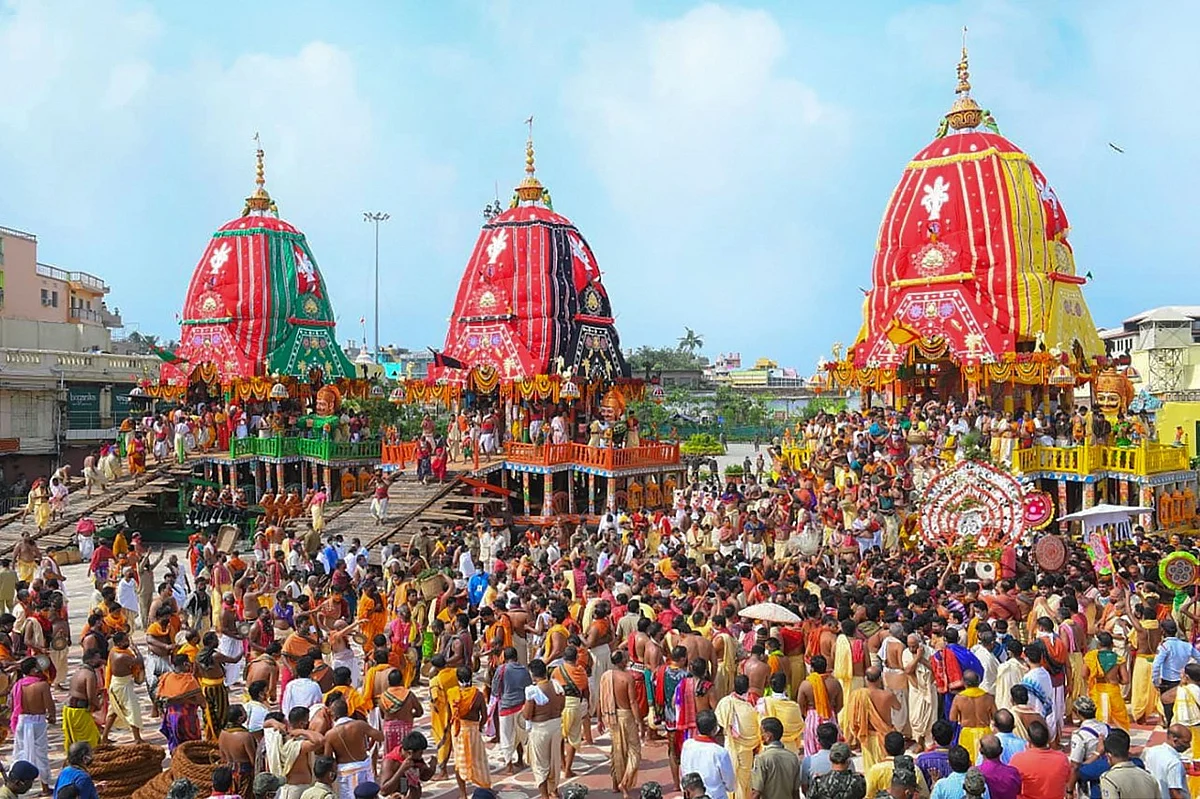 Priests and devotees take part in the pahandi rituals of Lord Jagannath Rath Yatra in Puri.