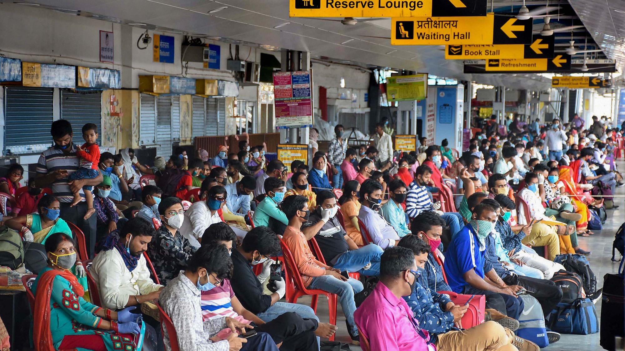 Passengers sit in the lounge area of Ranchi Railway station before boarding the Patna Jan Shatabdi Express, in Ranchi on Monday, 1 June. 