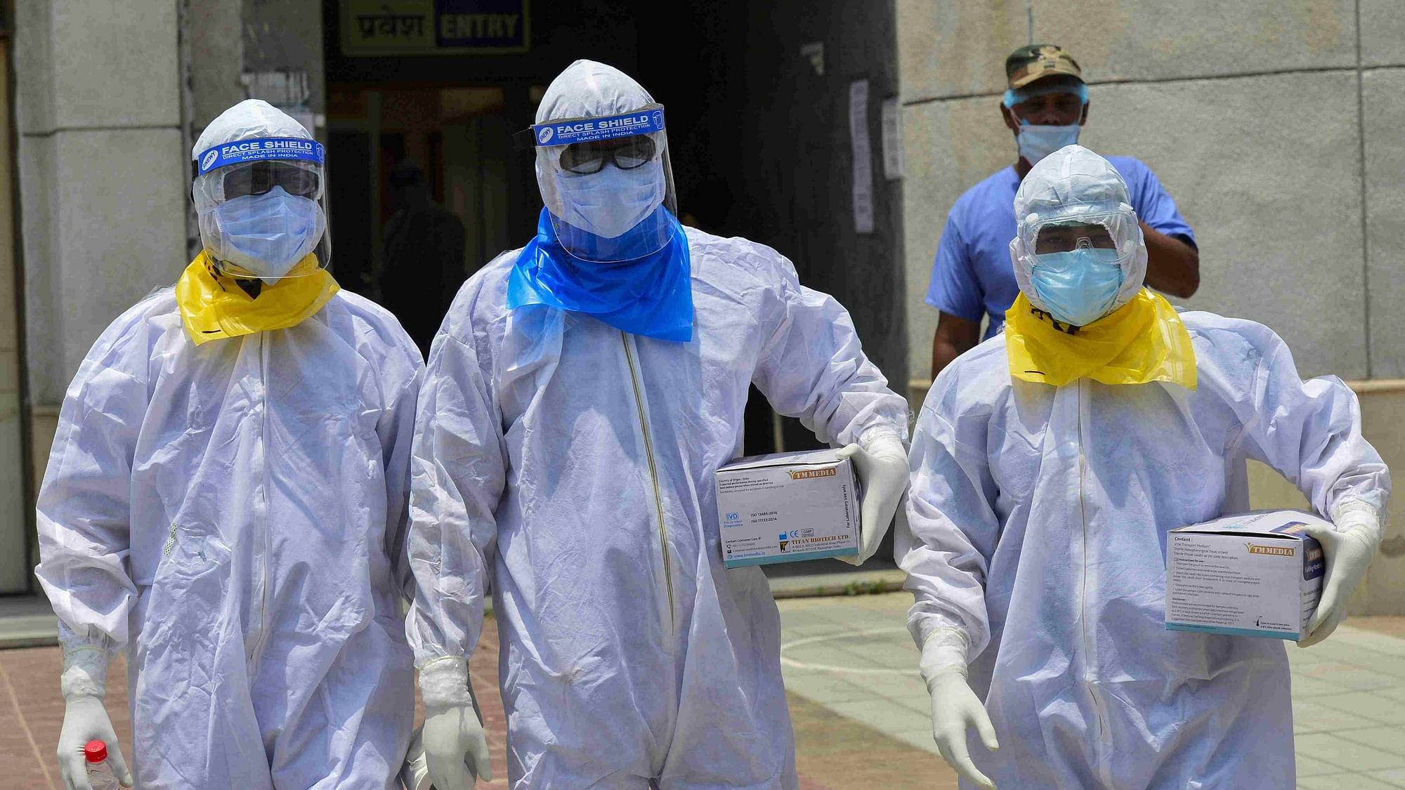 Medics arrive to take samples of suspected COVID-19 patients for lab tests at a government hospital in New Delhi.&nbsp; Image used for representation purpose.