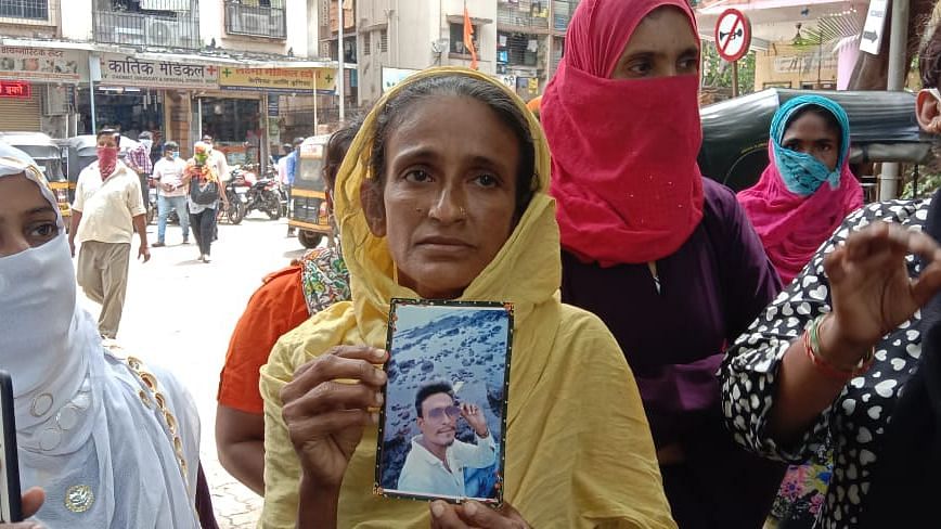 Murder victim Mehraj’s mother Noorjehan with the photo of her son.&nbsp;