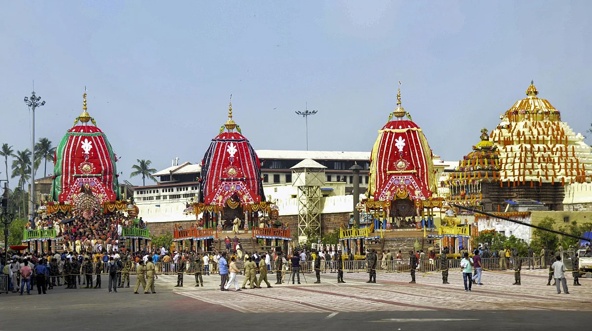 Devotees maintain social distancing while taking part in Lord Jagannath Rath Yatra at Bada Danda (the Grand Road) in Puri.