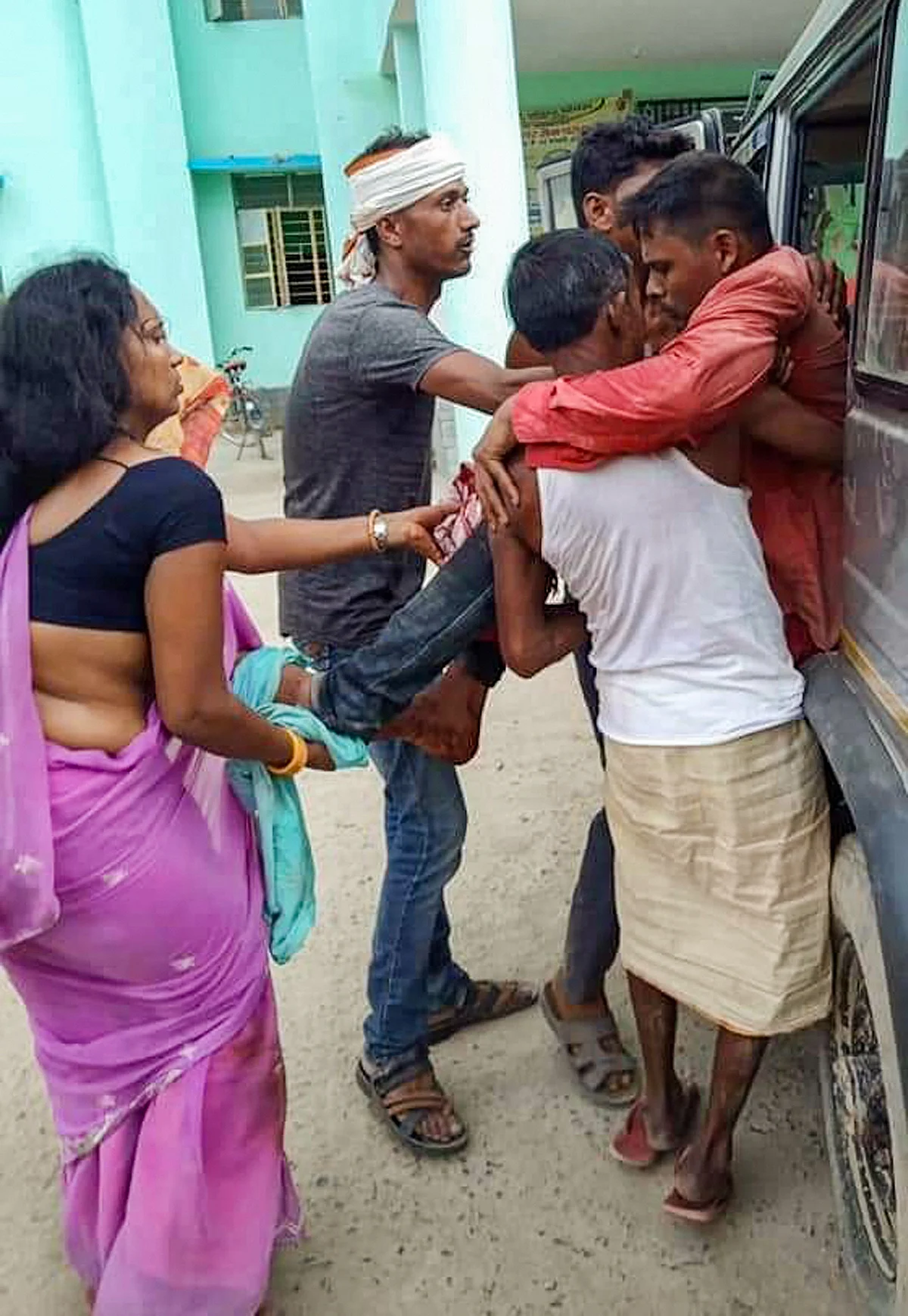 An injured villager is being shifted to a hospital.