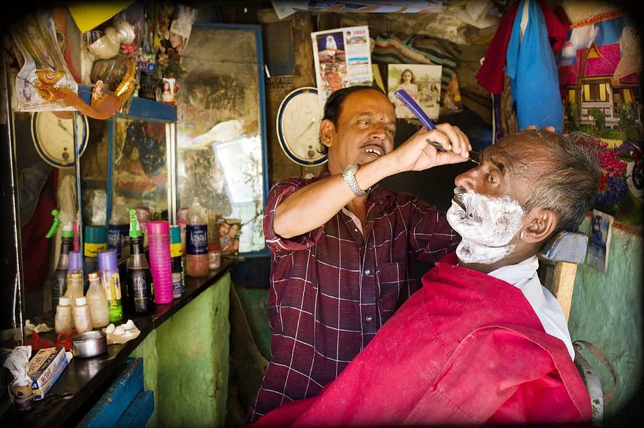 The neighbourhood barbershop also doubles as a hub where one can catch up on the latest happenings.