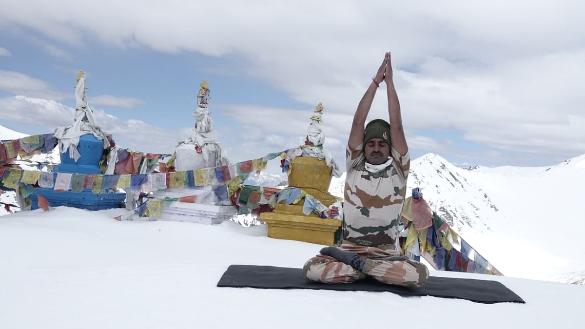 ITBP personnel practised yoga amidst the snow in Leh, Ladakh and Uttarakhand.