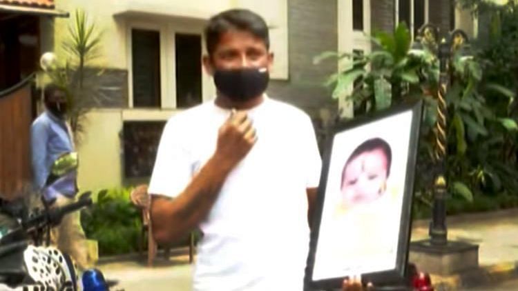 A man, whose one-month-old girl died due to lack of adequate medical care, protested in front of Karnataka Chief Minister BS Yediyurappa’s residence on Saturday.