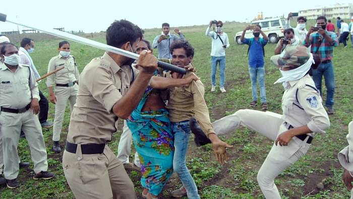 Policemen seen thrashing locals at the site of the incident.