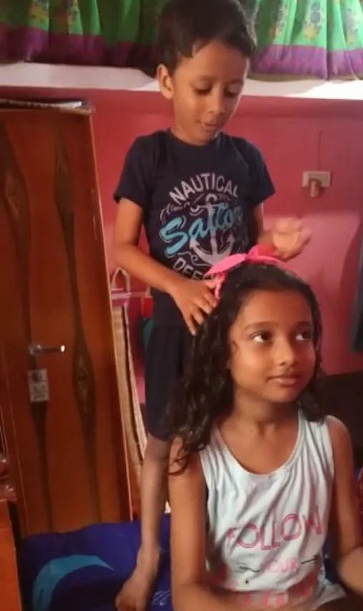 Arshad and Arsiya play at Mofijul's home.