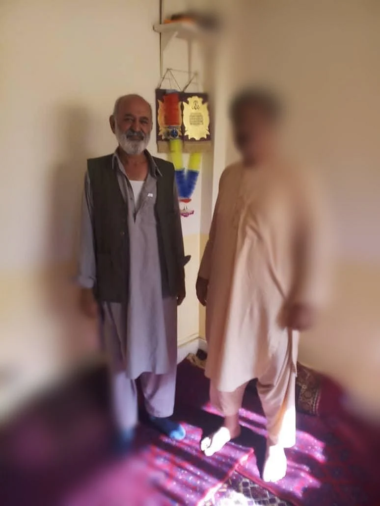 Photo of Nidan Singh with an Afghani security official. 