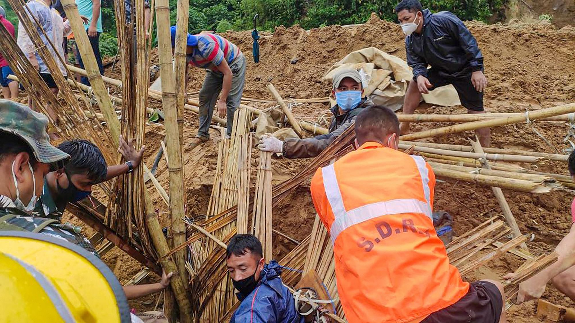 Rescue operation being carried out after a massive landslide hit a house following incessant rainfall, in Itanagar.