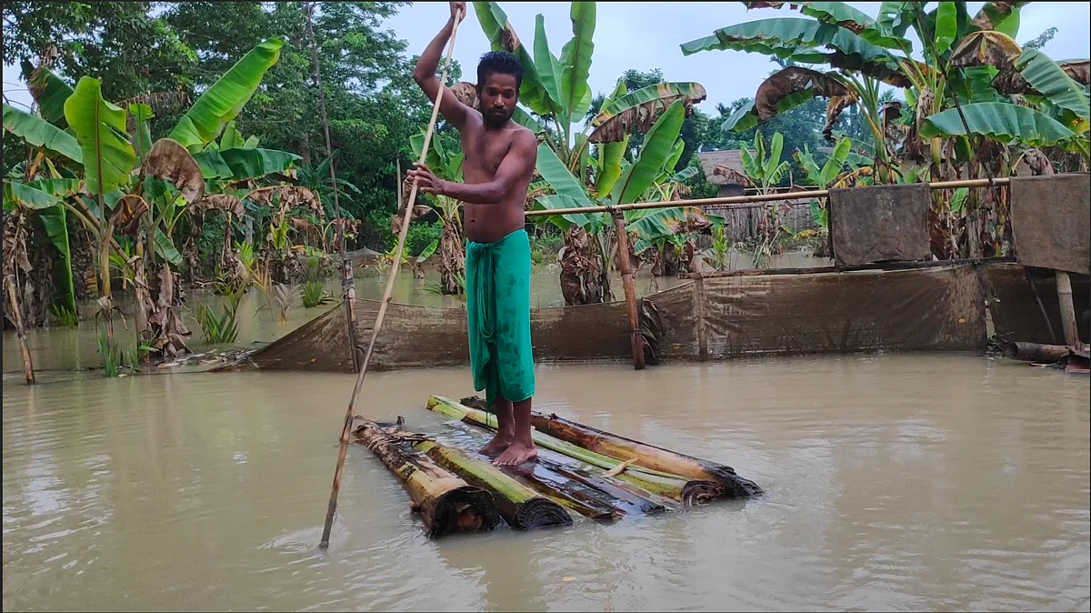 Jainal atop a makeshift banana raft.