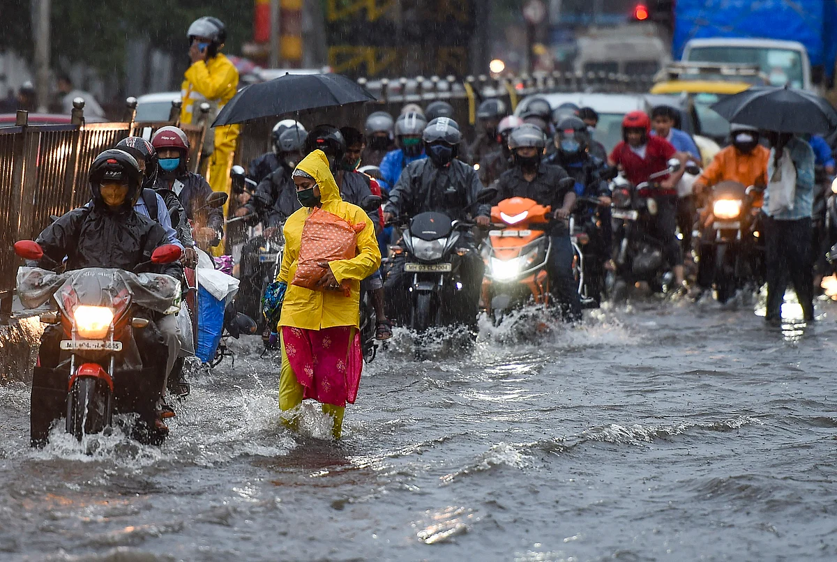 Vehicular traffic tries to move ahead in a water-logged street in Sion.