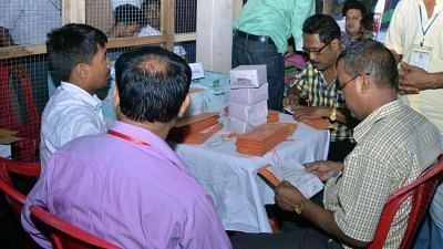Officials busy counting postal ballots inside a counting room. Image used for representational purpose.