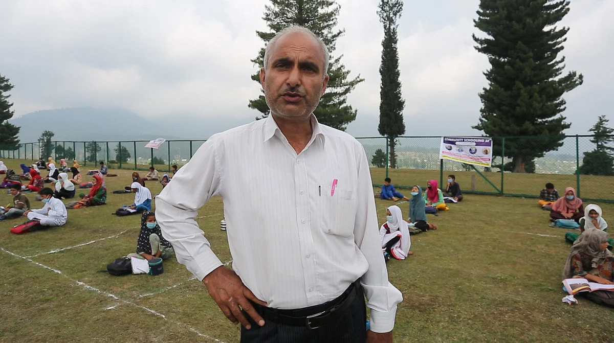 Education official Mohammad Ramzan at an open air community school in Doodhpathri resort.
