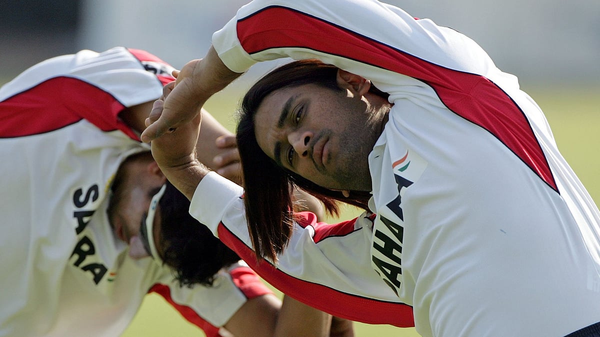 MS Dhoni in his early years in Indian cricket, with his famous long hair.