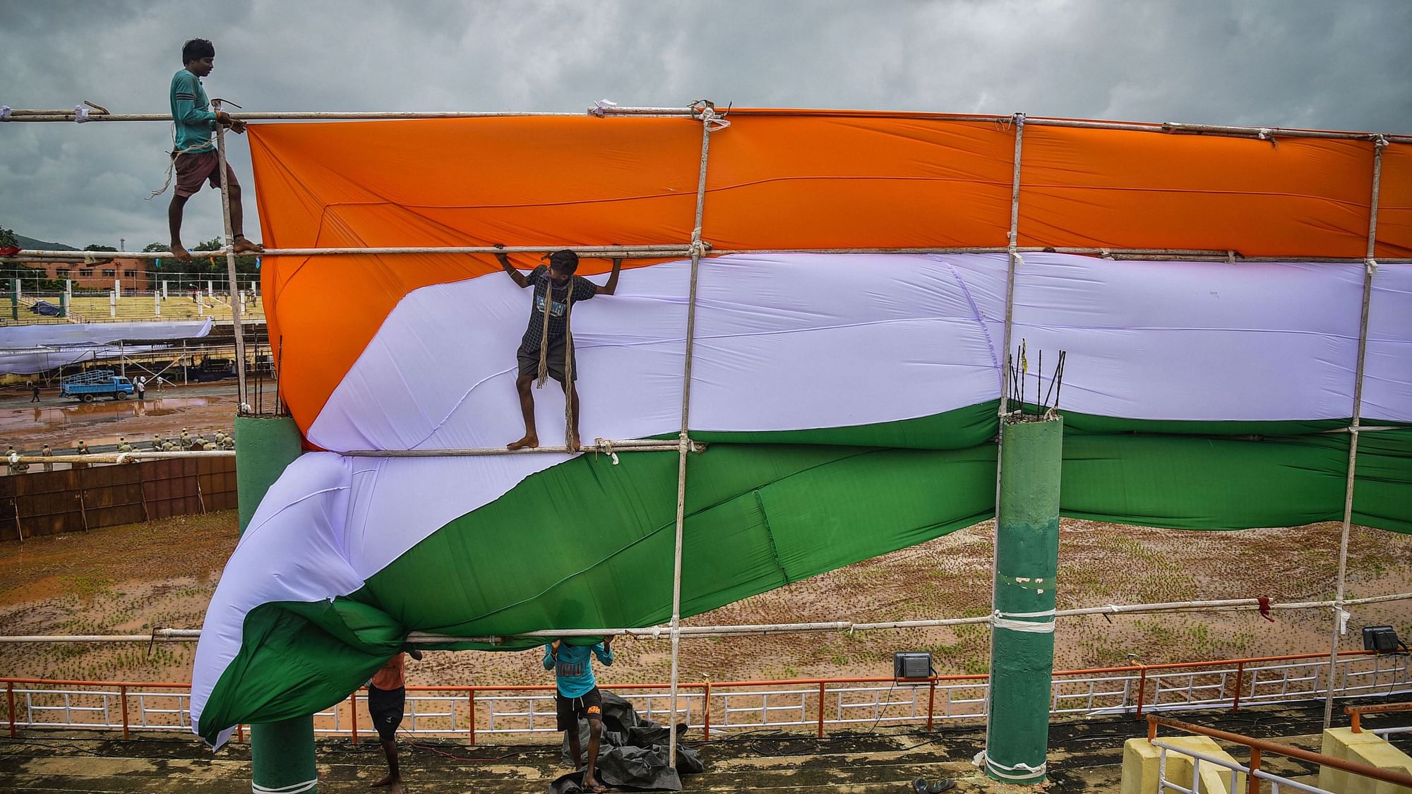 Workers busy in preparations for the upcoming 74th Independence Day celebrations, at Indira Gandhi Municipal Corporation Stadium in Vijayawada. &nbsp;