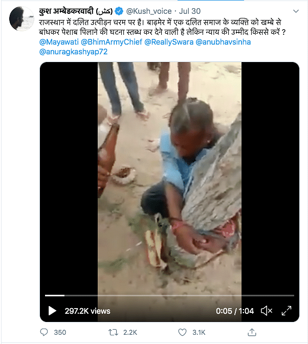 The video shows a man tied to a tree, being made to drink something out of a bottle, while people surround him.
