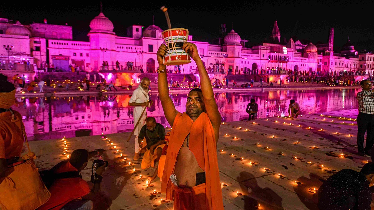 Devotees celebrate ‘Deepotsav’ at Ramghat on the eve of ‘bhoomi pujan’ of the Ram Temple, in Ayodhya on 4 August. 