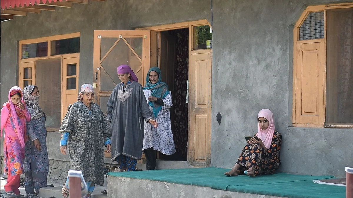 Women from the neighbourhood visiting the home of Shah to share their sympathies and blessings with his family.