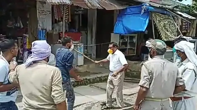 Uttar Pradesh’s Balia district’s SDM was seen going hitting people with a stick during a mask checking drive.