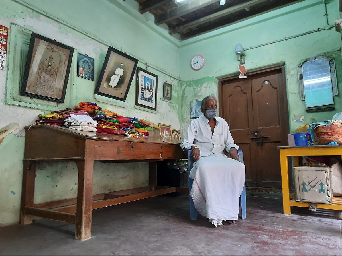Mani in his century old home with red oxide flooring.