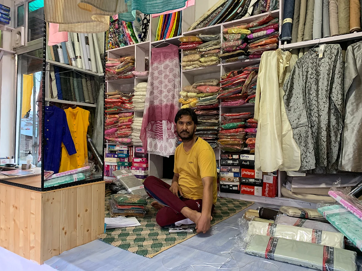 Plasma Donor Jehangir Hussain at his cloth shop in Budgam.