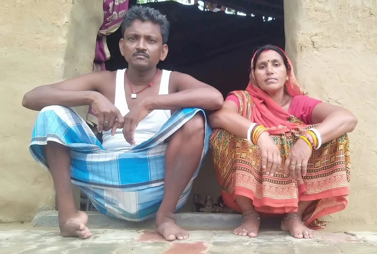 Kailash Ravidas at home with his wife.