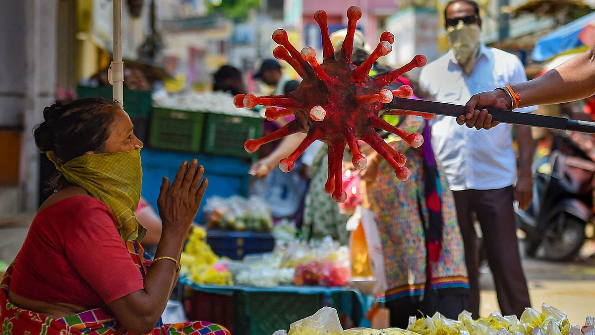 A policeman wearing a coronavirus-themed outfit walks at a market to raise awareness about social distancing, during a government-imposed nationwide lockdown as a preventive measure against COVID-19 in Chennai. Image used for representation.