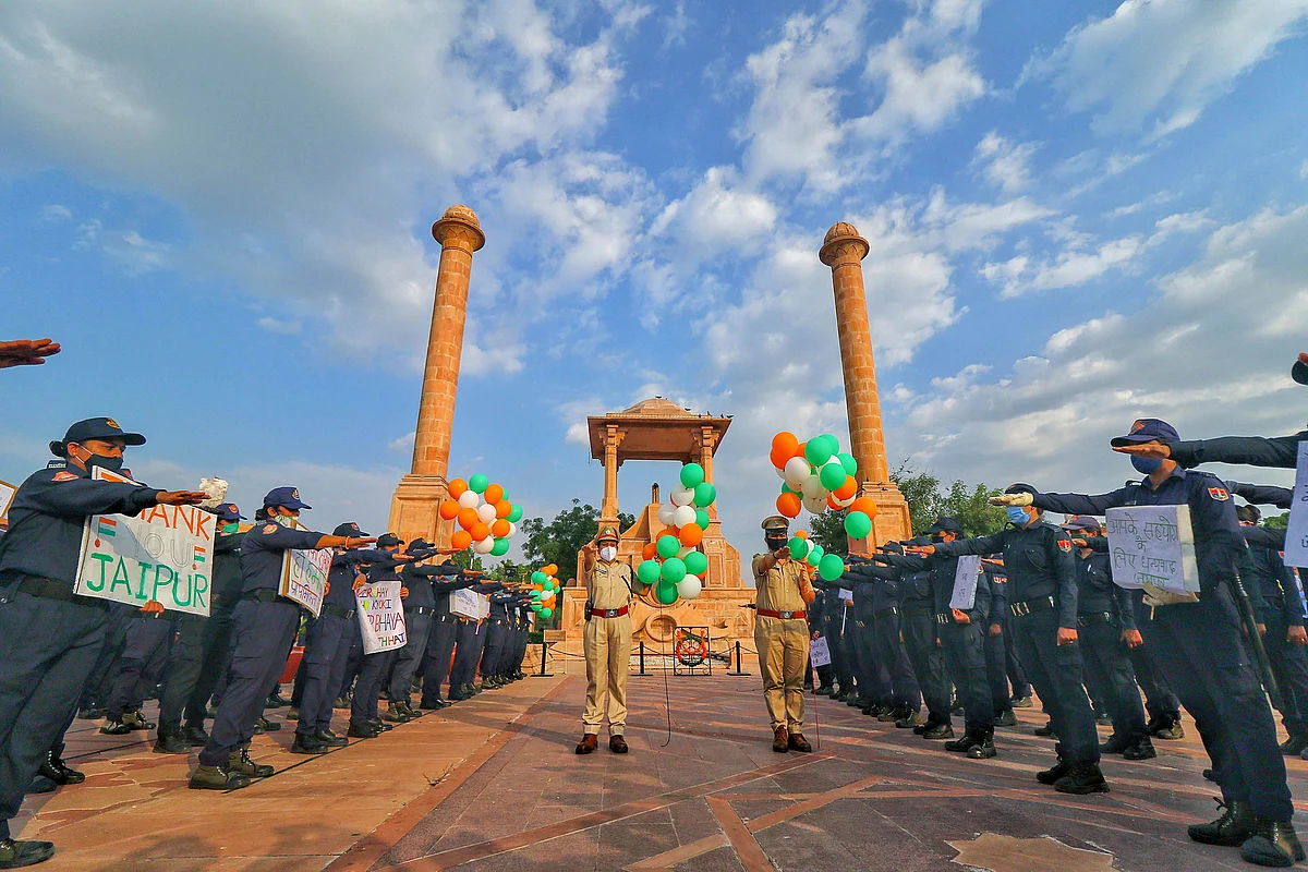 Nirbhaya Squad members of the police take oath for public safety and spread awareness on the their foundation day, at Amar Jawan Jyoti in Jaipur on 24 September.
