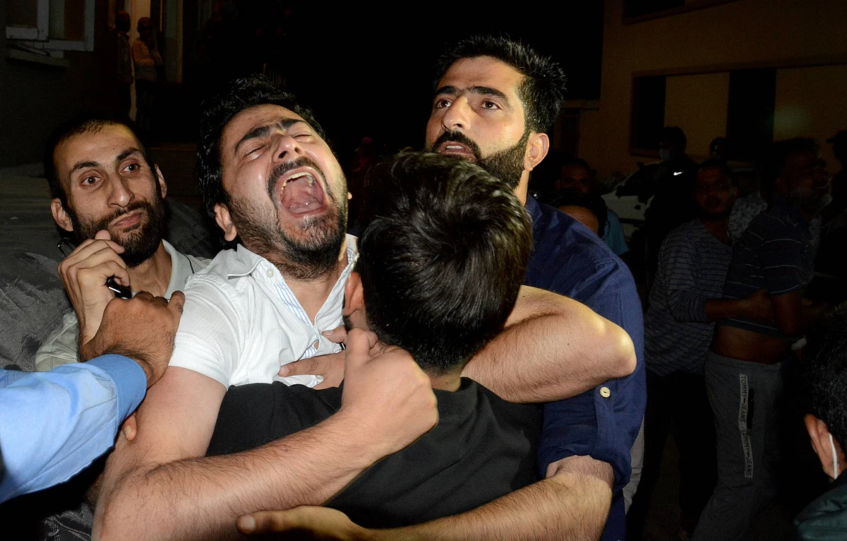 Brother of prominent Srinagar-based lawyer Babar Qadri, who was killed by unidentified gunmen, reacts during the funeral ceremony, at Hawal in Srinagar, Thursday evening, 24 September 2020.