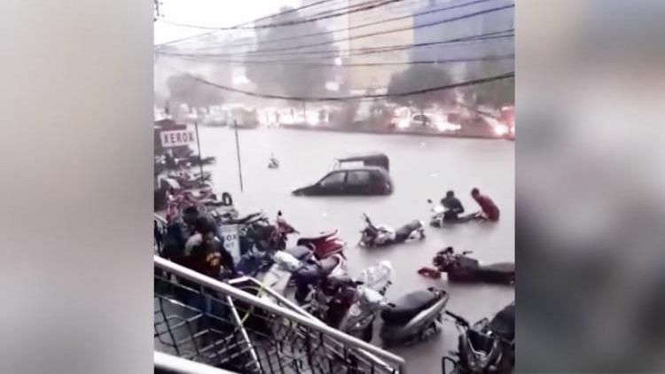 Vehicles submerged after sudden rainfall in Hyderabad