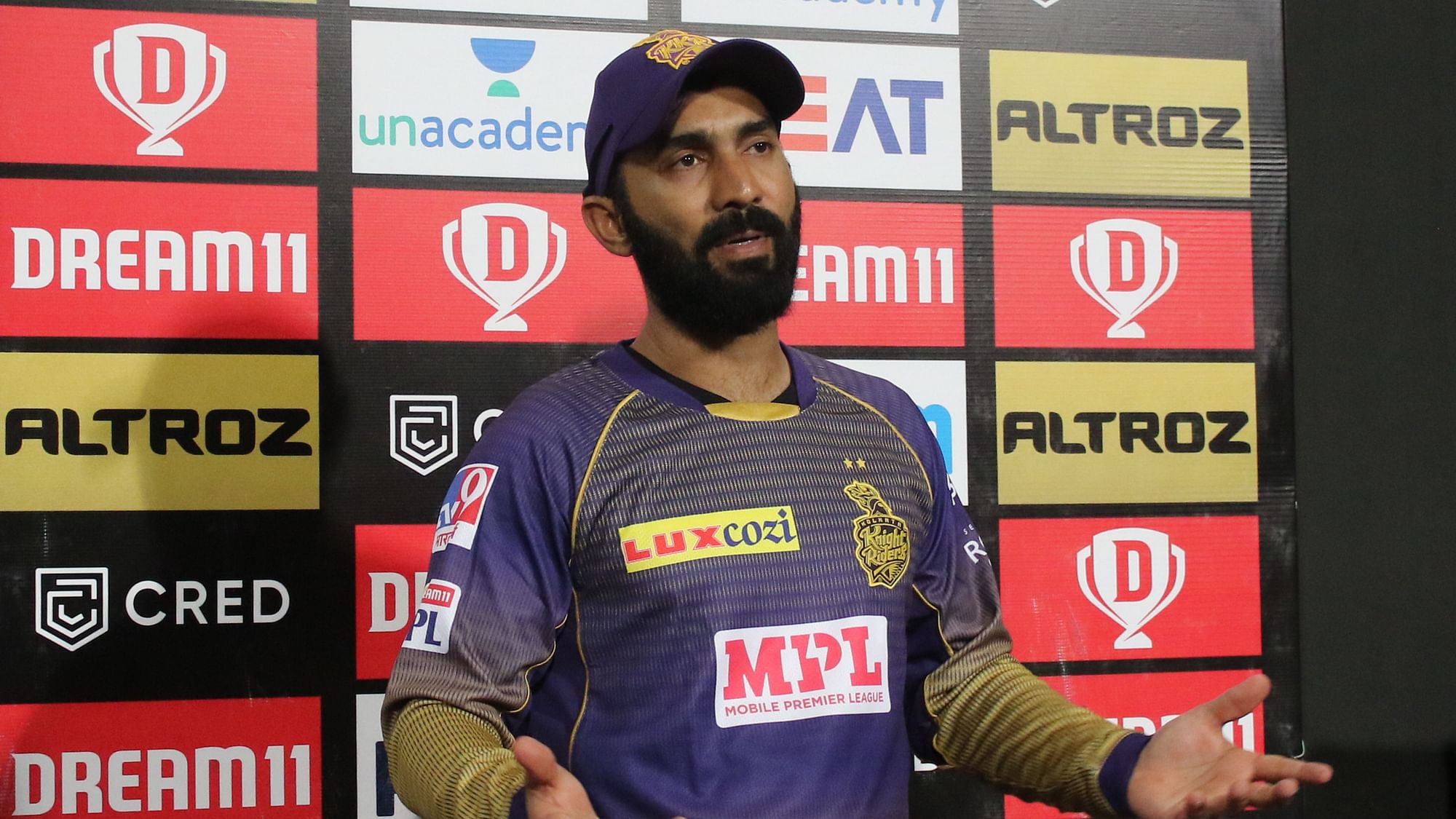 Dinesh Karthik defends Pat Cummins after the bowler leaks runs in the team’s first match of IPL 2020.