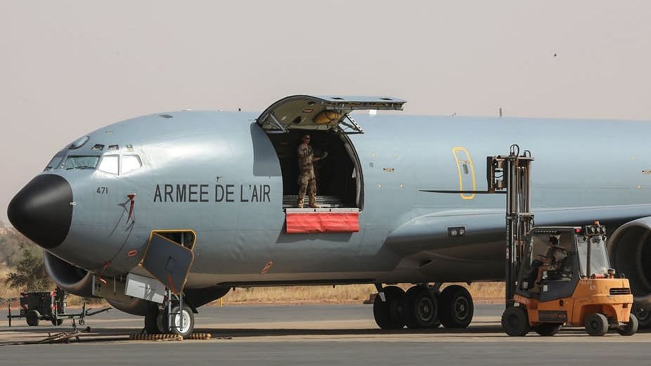 French Air Force soldiers work on a Boeing C135 parked on the French Air Force base in Niamey, Niger in December, 2017.