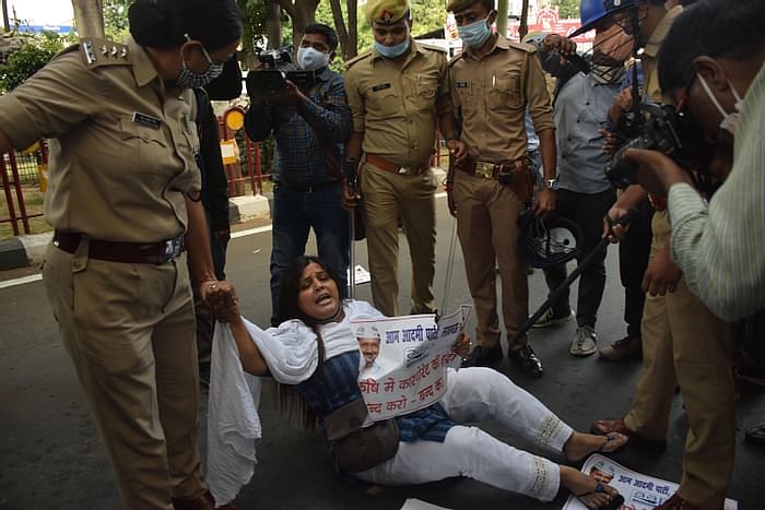 A protester being detained in Lucknow.