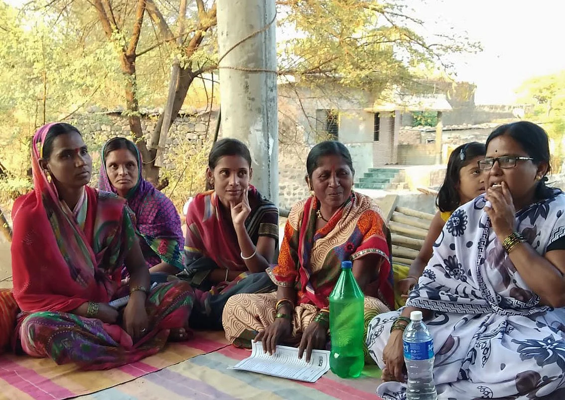 <i>‘I come in contact with many people everyday... Is a mere cloth mask sufficient?’ asks Nagini Survase (in a white saree.)</i>