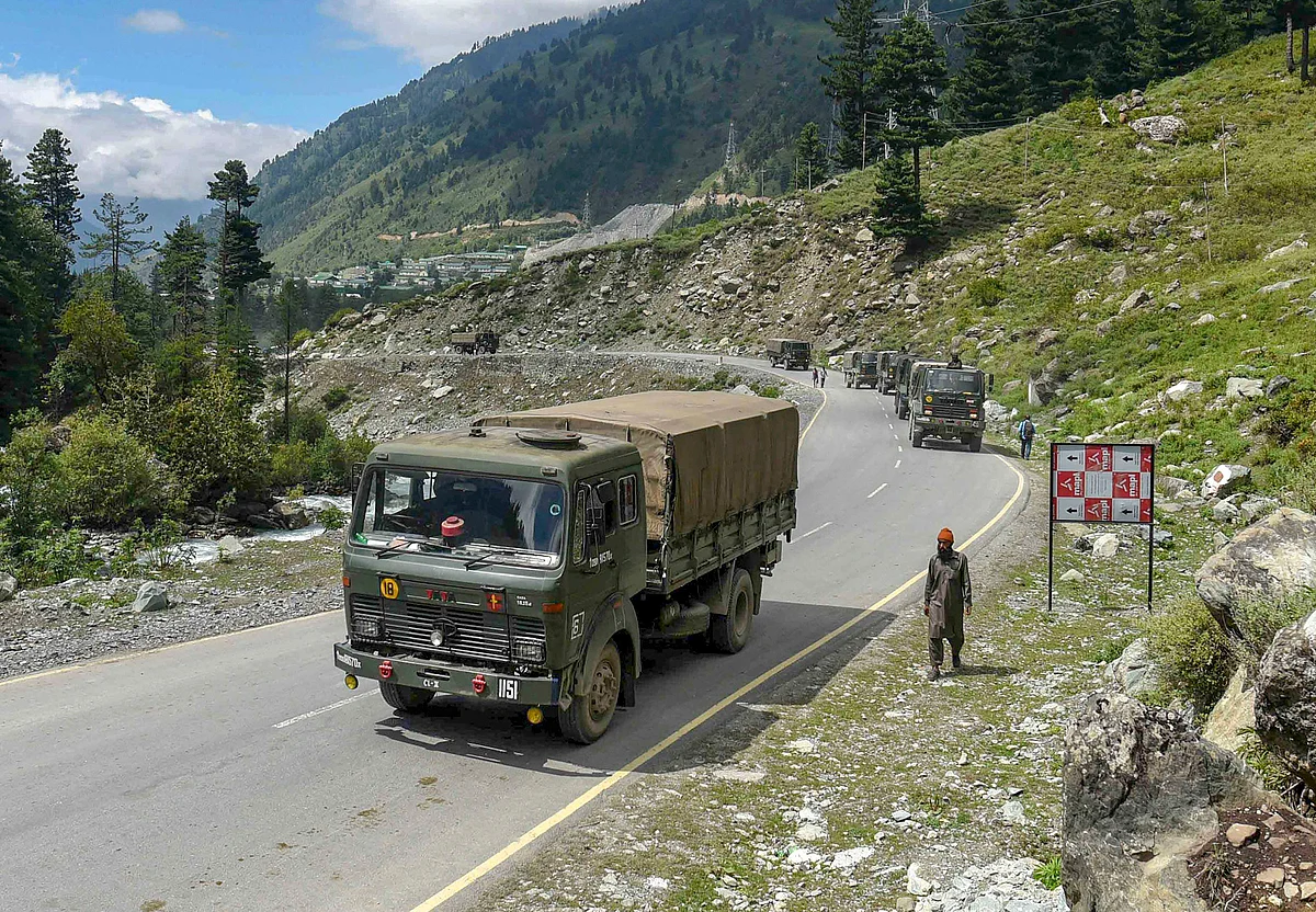 Army convoy moves on Srinagar- Ladakh highway at Gagangir, in Ganderbal district of Central Kashmir.