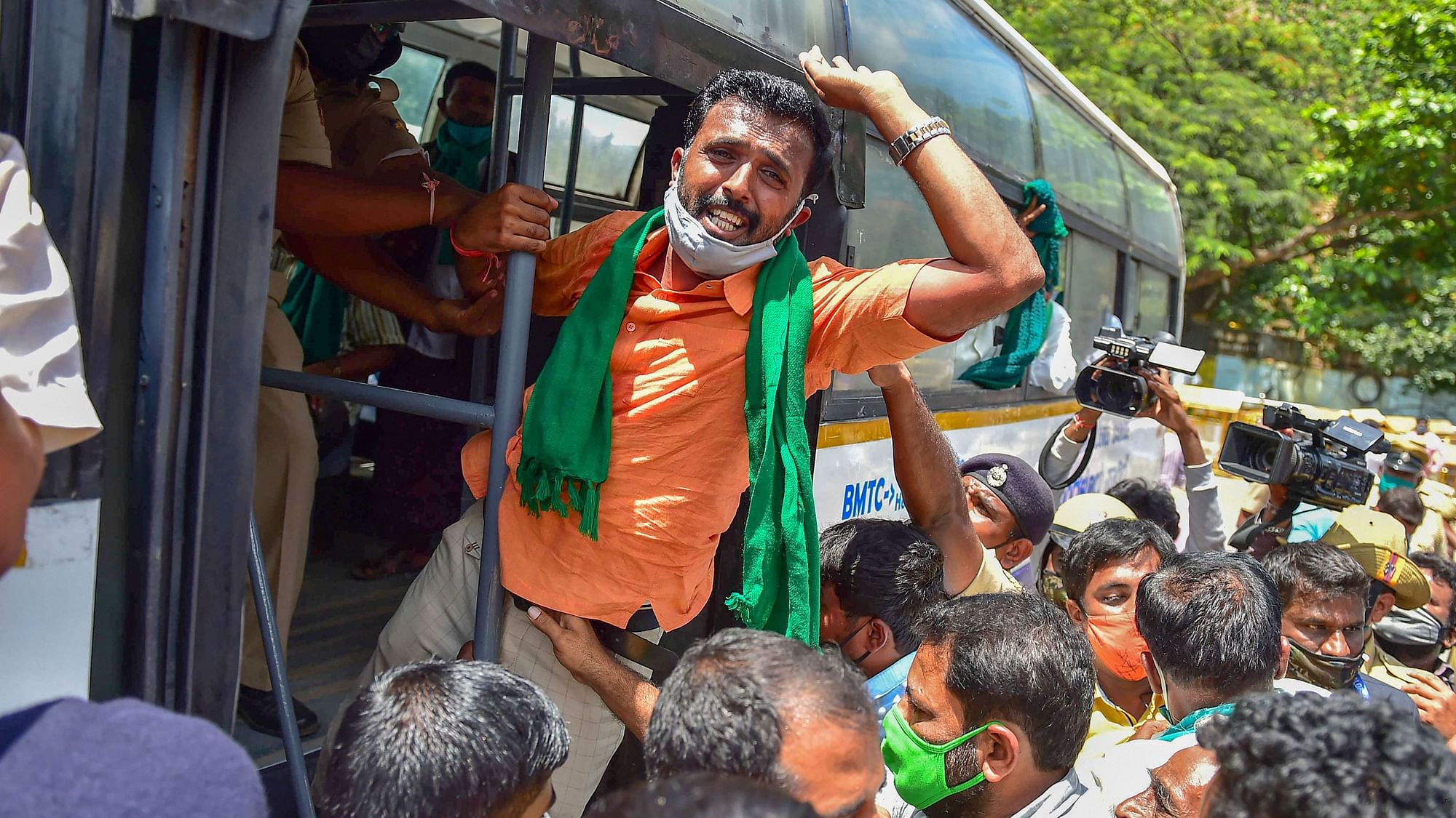 Members of various farmer organisations being detained by the police during Bharat Bandh, a protest against the farm bills passed in Parliament recently, in Bengaluru, Friday, 25 September.