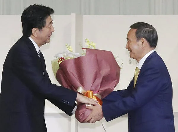 Yoshihide Suga takes over from Japan’s longest-serving prime minister, Shinzo Abe